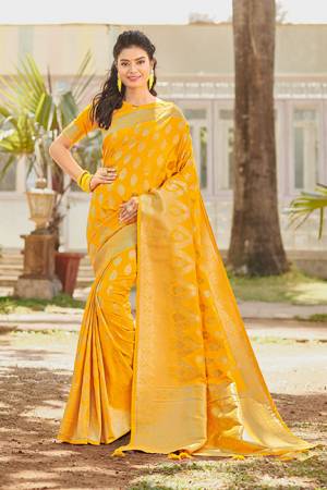 Enhance Your Personality Wearing This Rich Looking Saree In Musturd Yellow Color. This Saree And Blouse Are Silk Based Beautified With Attractive Weave All Over. It Is Light Weight, Durable And Easy To Care For.
