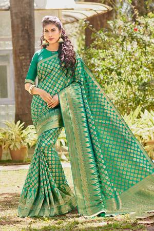 For A Proper Traditional Look, Grab This Designer Silk Based Saree In Sea Green Color. This Saree And Blouse Are Fabricated On Art Silk. It Is Beautified With Heavy Weave All Over. 