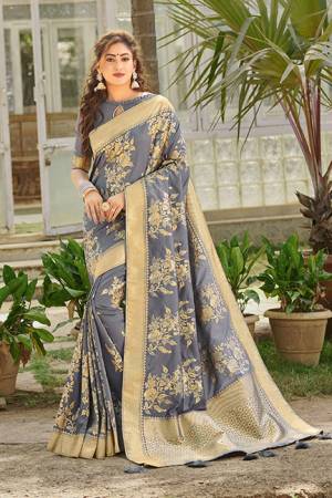 Enhance Your Personality Wearing This Rich Looking Saree In Grey Color. This Saree And Blouse Are Silk Based Beautified With Attractive Weave All Over. It Is Light Weight, Durable And Easy To Care For.