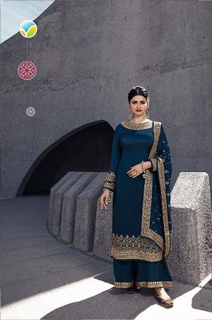 Enhance Your Personality Wearing This Elegant Embroidered Designer Straight Suit In Teal Blue Color. Its Top Is Fabricated On Satin Georgette Paired With Santoon Bottom And Silk Georgette Dupatta. Its Rich Fabric And Color Will Definitely Earn You Lots Of Compliments From Onlookers. 