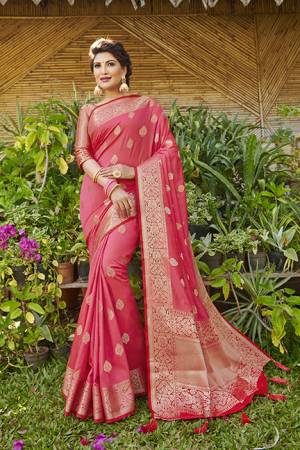 Here Is A Very Pretty Heavy Weaved Designer Saree In Pink Color Paired With Red Colored Blouse. This Saree And Blouse Are Silk Based And Is Suitable For Festive Or Occasion Wear. Buy Now.