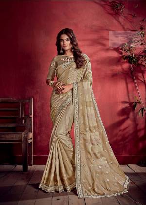 Rich And Elegant Looking Designer Saree Is  Here In Beige Color Paired With Beige Colored Blouse. This Saree and Blouse Are Tussar Silk Based Beautified With Prints And Thread Work. Buy Now.