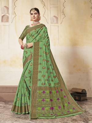 Celebrate This Festive Season Wearing This Designer Silk Based Saree In Light Green Color. This Saree And Blouse Are Fabricated On Art Silk Beautified With Weave All Over. 
