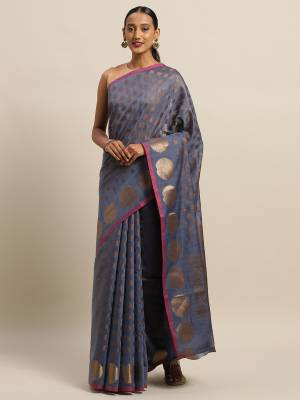 Simple And Elegant Looking Designer Weaved Saree Is Here In Grey?Color Paired With Dark Grey Colored Embroidered Blouse. This Saree And Blouse Are Fabricated On Handloom Silk Which Is Durable, Light Weight And Easy To Care For.