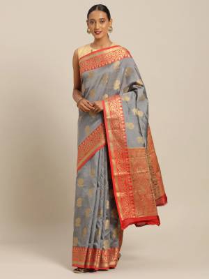 Celebrate This Festive Season With Beauty And Comfort Wearing This Designer Saree In Grey Color Paired with Contrasting Orange Colored Blouse. This Saree and Blouse Are Fabricated On Cotton Handloom Which Gives A Rich Look To Your Personality