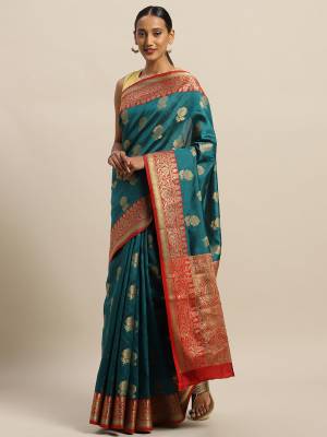 Celebrate This Festive Season With Beauty And Comfort Wearing This Designer Saree In Teal Blue Color Paired with Contrasting Red Colored Blouse. This Saree and Blouse Are Fabricated On Cotton Handloom Which Gives A Rich Look To Your Personality