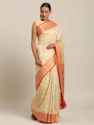 Simple And Elegant Looking Designer Weaved Saree Is Here In Cream?Color Paired With Contrasting Orange Colored Embroidered Blouse. This Saree And Blouse Are Fabricated On Handloom Silk Which Is Durable, Light Weight And Easy To Care For.