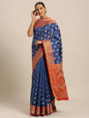 Simple And Elegant Looking Designer Weaved Saree Is Here In Navy Blue Color Paired With Contrasting Red Colored Embroidered Blouse. This Saree And Blouse Are Fabricated On Handloom Silk Which Is Durable, Light Weight And Easy To Care For.