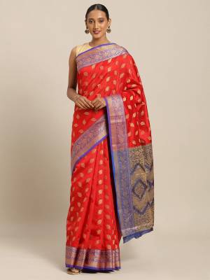 Simple And Elegant Looking Designer Weaved Saree Is Here In Red?Color Paired With Contrasting Blue Colored Embroidered Blouse. This Saree And Blouse Are Fabricated On Handloom Silk Which Is Durable, Light Weight And Easy To Care For.