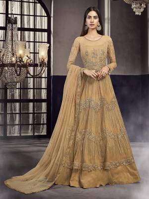 Flaunt Your Rich And Elegant Taste Wearing This Heavy designer Floor Length Suit In Occur Yellow Color. Its Top Is Fabricated On Net And Art Silk Paired With Santoon  Bottom And Net Fabricated Dupatta. 