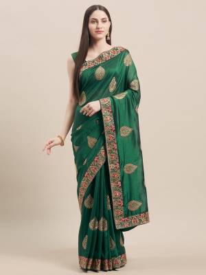 Grab This Designer Saree In Dark Green Color Paired With Dark Green Colored Blouse. This Saree and Blouse Are Fabricated On Vichitra Silk Beautified With Embroidered Motifs And Lace Border. Buy Now. 