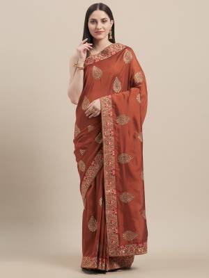 Grab This Designer Saree In Rust Orange Color Paired With Golden Colored Blouse. This Saree and Blouse Are Fabricated On Vichitra Silk Beautified With Embroidered Motifs And Lace Border. Buy Now. 