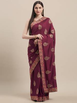 Grab This Designer Saree In Wine Color Paired With Golden Colored Blouse. This Saree and Blouse Are Fabricated On Vichitra Silk Beautified With Embroidered Motifs And Lace Border. Buy Now. 