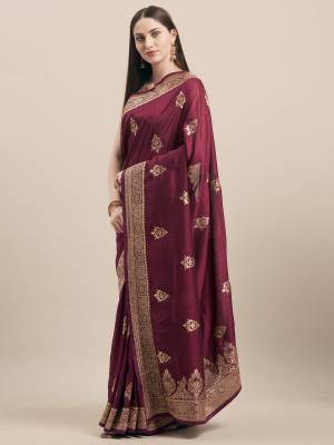 Look Pretty In This Rich And Elegant Embroidered Designer Saree In Wine Color Paired With Golden Colored Blouse. This Saree and Blouse Are Tussar Silk Based, Its Fabric And color Gives a Rich Look To Your Personality. 