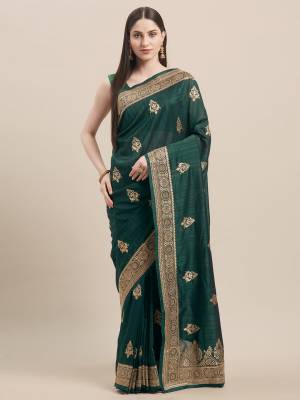 Look Pretty In This Rich And Elegant Embroidered Designer Saree In Dark Green Color Paired With Dark Green Colored Blouse. This Saree and Blouse Are Tussar Silk Based, Its Fabric And color Gives a Rich Look To Your Personality. 