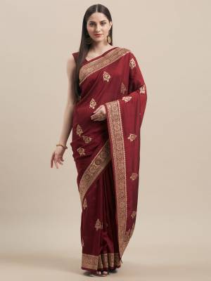 Look Pretty In This Rich And Elegant Embroidered Designer Saree In Maroon Color Paired With Maroon Colored Blouse. This Saree and Blouse Are Tussar Silk Based, Its Fabric And color Gives a Rich Look To Your Personality. 