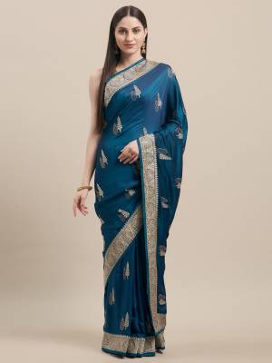 Flaunt Your Rich and Elegant Taste In Minimal Embroidered Designer saree In Blue Color Paired With Golden Colored Blouse. This Pretty Saree Is Fabricated On Satin Silk Paired With Art Silk Fabricated Blouse. 