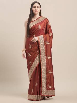 Flaunt Your Rich and Elegant Taste In Minimal Embroidered Designer saree In Rust Orange Color Paired With Golden Colored Blouse. This Pretty Saree Is Fabricated On Satin Silk Paired With Art Silk Fabricated Blouse. 
