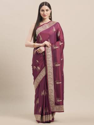 Flaunt Your Rich and Elegant Taste In Minimal Embroidered Designer saree In Wine Color Paired With Golden Colored Blouse. This Pretty Saree Is Fabricated On Satin Silk Paired With Art Silk Fabricated Blouse. 