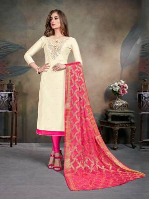 Celebrate This Festive Season With This Pretty suit In Cream Colored Top Paired With Dark Pink Colored Bottom and Dupatta. Its Top Is Fabricated On Modal Silk Paired With Cotton Bottom and Chiffon Jacquard Dupatta. Buy This Dress Material Now.