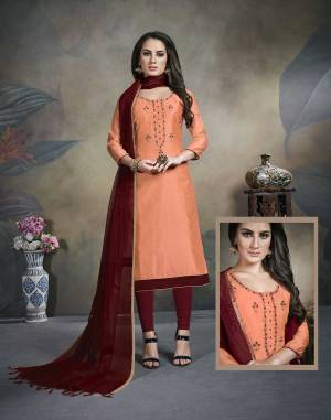 Grab This Pretty Designer Straight Suit In Orange Color Paired With Contrasting Maroon Colored Bottom And Dupatta. Its Top Is Fabricated On Modal Silk Paired With Cotton Bottom And Banarasi Dupatta. 