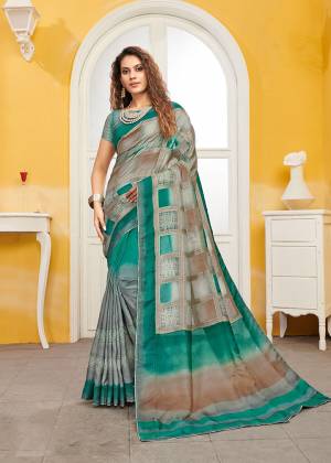Celebrate This Festive Season With Beauty And Comfort Wearing This Designer Saree In Grey And Sea Blue color. This Saree And Blouse Are Viscose Based Beautified With Weave. It Is Light Weight and Easy To Carry All Day Long. 