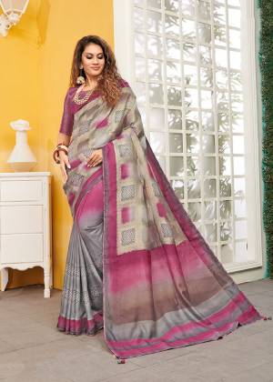 Celebrate This Festive Season With Beauty And Comfort Wearing This Designer Saree In Grey And Pink color. This Saree And Blouse Are Viscose Based Beautified With Weave. It Is Light Weight and Easy To Carry All Day Long. 