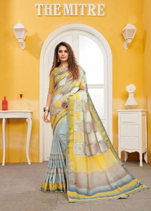 Celebrate This Festive Season With Beauty And Comfort Wearing This Designer Saree In Grey And Yellow color. This Saree And Blouse Are Viscose Based Beautified With Weave. It Is Light Weight and Easy To Carry All Day Long. 