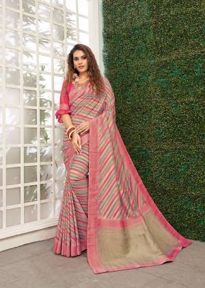 Celebrate This Festive Season With Beauty And Comfort Wearing This Designer Saree In Grey And Pink color. This Saree And Blouse Are Viscose Based Beautified With Weave. It Is Light Weight and Easy To Carry All Day Long. 