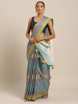 Rich And Elegant Looking Simple Saree Is Here For Your Semi-Casual Wear In Grey Color Paired With Sky Blue Colored Blouse. This Saree and Blouse Are Fabricated On Linen Cotton. Its Color And Fabric Gives A Rich Look To Your Personality.  