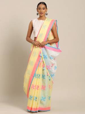 Rich And Elegant Looking Simple Saree Is Here For Your Semi-Casual Wear In Yellow Color Paired With Sky Blue Colored Blouse. This Saree and Blouse Are Fabricated On Linen Cotton. Its Color And Fabric Gives A Rich Look To Your Personality.  
