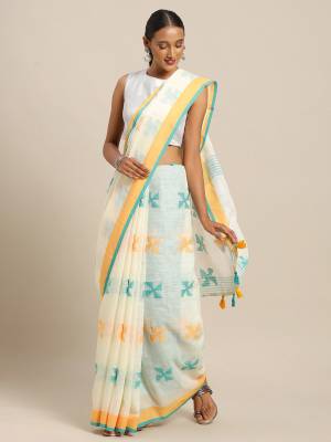 Rich And Elegant Looking Simple Saree Is Here For Your Semi-Casual Wear In Off-White Color Paired With Sky Blue Colored Blouse. This Saree and Blouse Are Fabricated On Linen Cotton. Its Color And Fabric Gives A Rich Look To Your Personality.  