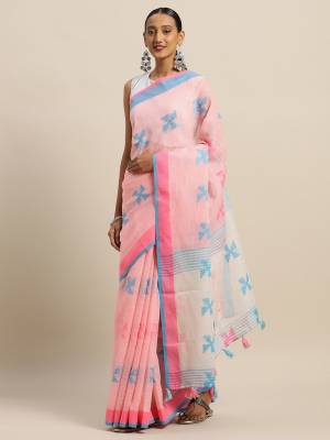 Rich And Elegant Looking Simple Saree Is Here For Your Semi-Casual Wear In Baby Pink Color Paired With Sky Blue Colored Blouse. This Saree and Blouse Are Fabricated On Linen Cotton. Its Color And Fabric Gives A Rich Look To Your Personality.  