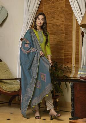 New And Unique Styled Multi Colored Designer Straight Suit Is Here In Parrot Green Colored Top Paired With Contrasting Beige Colored Bottom and Blue Colored Dupatta. Its Top Is Fabricated On Muslin Paired With Cotton Bottom And Its Dupatta Is Fabricated On Silk Handloom. 