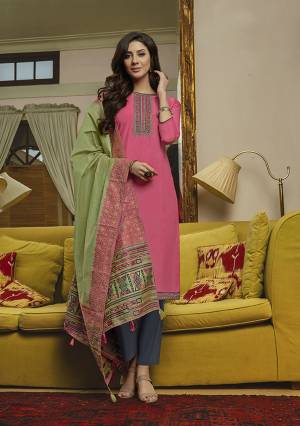 Get Ready For The Upcoming Festive Season With This Pretty Colorful Straight Suit In Pink Colored Top Paired With Contrasting Dark Grey colored Bottom And Light Green Colored Dupatta. Its Top Is Muslin Based Paired With Cotton Bottom And Silk Handloom Dupatta. 