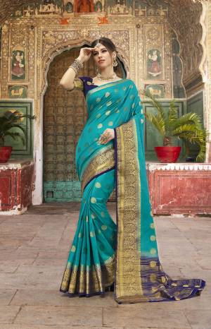 Adorn A Proper Traditional Look Wearing This Designer Silk Based Saree In Blue Color Paired With Navy Blue Colored Blouse. This Saree And Blouse Are Fabricated On Nylon Silk Beautified With Weave. 