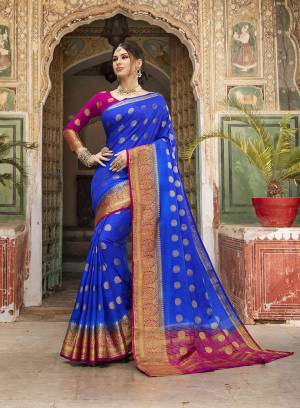 Adorn A Proper Traditional Look Wearing This Designer Silk Based Saree In Royal Blue Color Paired With Rani Pink Colored Blouse. This Saree And Blouse Are Fabricated On Nylon Silk Beautified With Weave. 