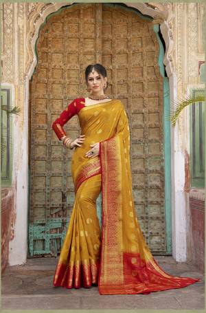 Look Attractive In This Pretty Musturd Yellow Colored Saree Paired With Red Colored Blouse. This Saree And Blouse Are Fabricated On Nylon Silk Beautified With Weave All Over. Buy This Saree Now.