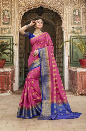 Look Attractive In This Pretty Pink Colored Saree Paired With Royal Blue Colored Blouse. This Saree And Blouse Are Fabricated On Nylon Silk Beautified With Weave All Over. Buy This Saree Now.