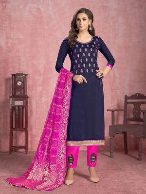 Here Is A Pretty Designer Dress Material In Navy Blue Colored Top Paired With Rani Pink Colored Bottom and Dupatta. Its Top Is Fabricated On Cotton Paired With Semi Lawn Bottom And Banarasi Silk Dupatta. 