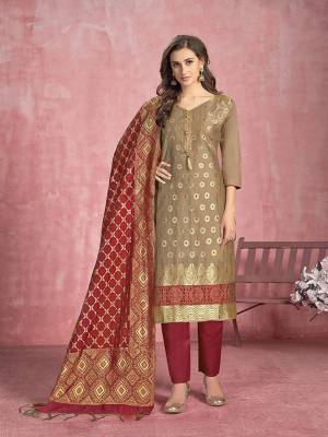 For Your Semi-Casuals, Get This Pretty Straight Suit In Beige Colored Top Paired With Maroon Colored Bottom And Dupatta. Its Top Is Fabricated On Cotton Paired With Semi Lawn Bottom and Banarasi Silk Dupatta. Buy This Semi-Stitched Suit Now.