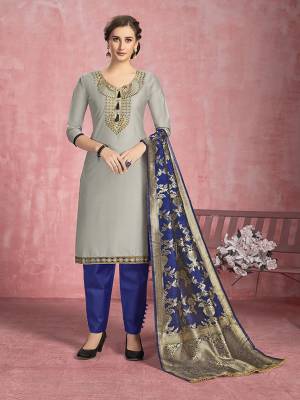 For Your Semi-Casuals, Get This Pretty Straight Suit In Grey Colored Top Paired With Royal Blue Colored Bottom And Dupatta. Its Top Is Fabricated On Cotton Paired With Semi Lawn Bottom and Banarasi Silk Dupatta. Buy This Semi-Stitched Suit Now.