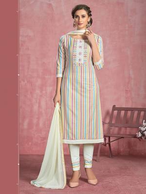 Here Is A Pretty Designer Dress Material In Off-White And Multi Colored Top Paired With Off-White Colored Bottom and Dupatta. Its Top Is Fabricated On Cotton Paired With Semi Lawn Bottom And Chiffon Dupatta. 