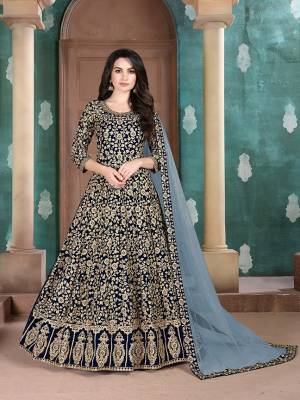 Get Ready For The Upcoming Wedding Season With This Attractive Looking Heavy Designer Floor Length Suit In Navy Blue Color. This Pretty Heavy Embroidered Suit Is Fabricated On Georgette Paired With Santoon Bottom And Net Fabricated Dupatta. Its Bright Color And Heavy Embroidery Will Give An Attractive Look To Your Personality. 