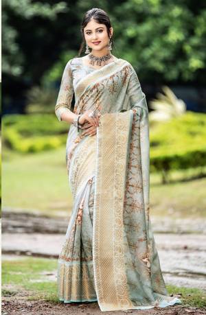 Here Is Pretty Designer Saree In Grey Color Paired With Grey Colored Blouse. This Saree And Blouse Are Fabricated On Cotton Beautified With Prints And Weave. Its Fabric Is Light Weight And  Easy To Carry All Day Long. 