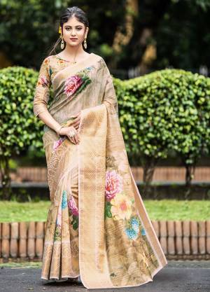 Here Is Pretty Designer Saree In Beige Color Paired With Beige Colored Blouse. This Saree And Blouse Are Fabricated On Cotton Beautified With Prints And Weave. Its Fabric Is Light Weight And  Easy To Carry All Day Long. 