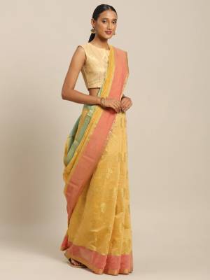 Pretty Simple And Elegant Looking Saree For Your Semi-Casual Wear Is Here In Occur Yellow color Paired With Contrasting Dark Peach Colored Blouse. This Saree and Blouse Are Fabricated On Cotton Handloom Beautified With Weave. 