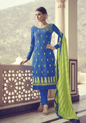 Grab This Designer Straight Suit In Royal Blue Color Paired With Contrasting Parrot Green Colored Dupatta. Its Top and Dupatta Are Chiffon Based Paired With Santoon Bottom. It IS Light Weight, Durable And Easy To Carry. 