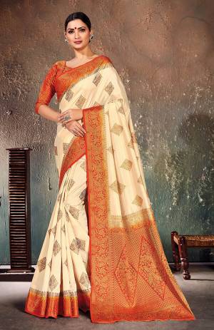 Adorn A Proper Traditional Look Wearing This Designer Silk Based?Saree In Cream Color Paired With Orange Colored Blouse. This Saree And Blouse Are Fabricated On Nylon Silk Beautified With Weave