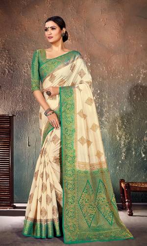 Look Attractive In This Pretty Cream Colored Saree Paired With Teal Green Colored Blouse. This Saree And Blouse Are Fabricated On Nylon Silk Beautified With Weave All Over. Buy This Saree Now.?